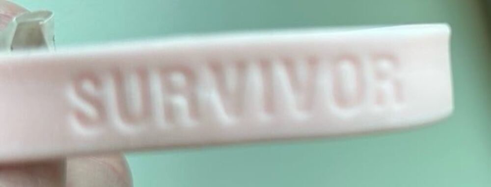 Pink rubber wrist band Survivor set of two